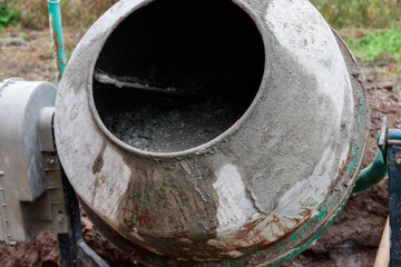 Mixing of concrete in the concrete mixer at construction site