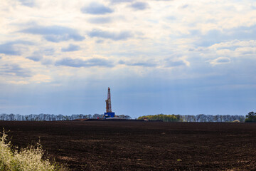 Land oil drilling rig on the field
