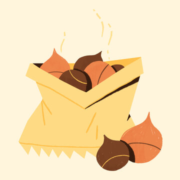 roasted chestnuts in a paper bag - autumnal street food snack