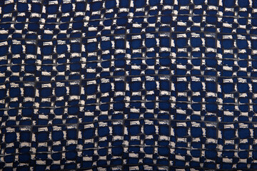 Texture background pattern. Silk fabric with a pattern of blue ,white and black squares ,100%...