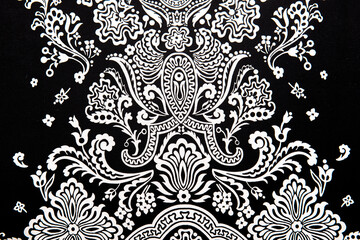vintage abstract white floral pattern on black  textiles fabric, retro background