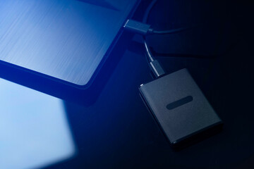 Data storage, protection of personal information concept. SSD disk inserted into the computer.