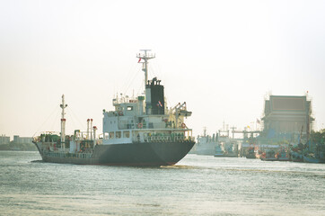 Fuel tanker was sailing in the estuary of the sea in the morning.