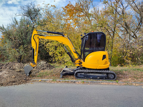 JCB digger or excavator performs excavation work outdoors