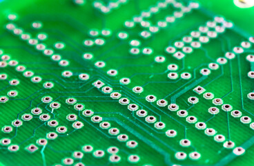 Printed green circuit board close-up. Electronic computer hardware technology macro photo. A...