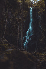 Mesmerizing view of the Burgbach waterfall the Black Forest with a cascade of water, Germany