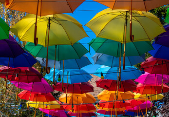 Fototapeta na wymiar many colorful umbrellas hanging up