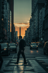 Vertical shot of a man wearing a mask crossing the street in Buenos Aires, Argentina at sunset