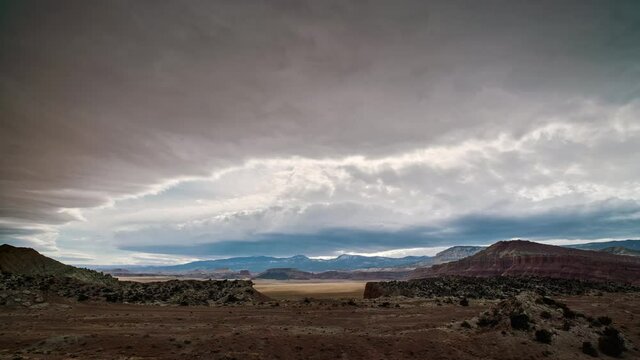 Time lapse of clouds rolling in the sky over the Utah desert looking towards Thousand Lake Mountain.