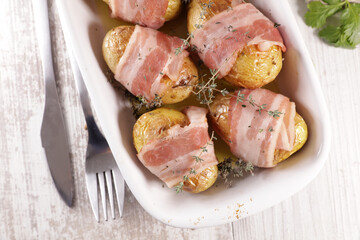 baked potato with bacon slices