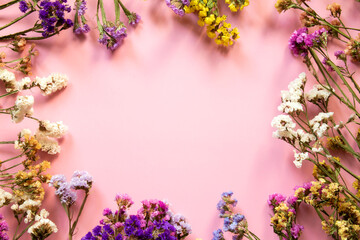 Flower composition. Frame made of dried flowers. Flat lay, top view with place for text.