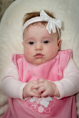 cute little baby girl with a beautiful white bow