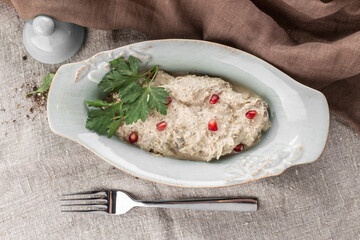 chicken salad with pomegranate and mayonnaise sauce on the table