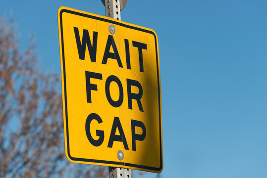 sign on the road "wait for gap"