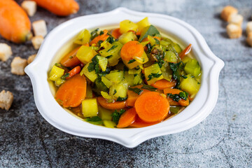 Minestrone soup with croutons, detox food for a light and healthy dinner. Ideal dish for a vegan diet.