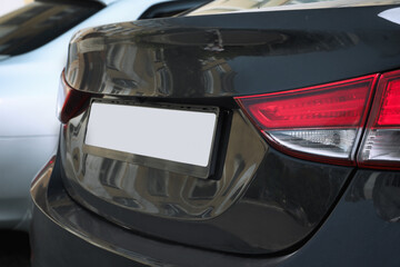 Closeup view of modern car with license plate outdoors