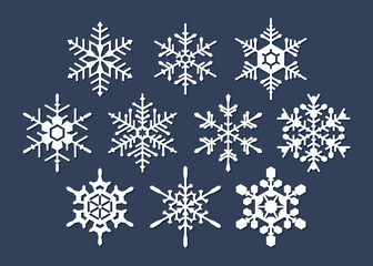 Fototapeta na wymiar Set of white snowflakes on blue background
