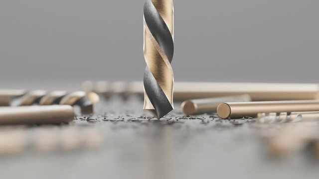 Shiny drill bits among metal shavings. High hardness beet ready to drill