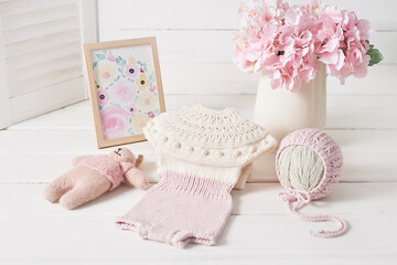 Knitted kids clothes and accessories for knitting. Needlework and knitting. Hobbies and creativity. Knit for children. Handmade