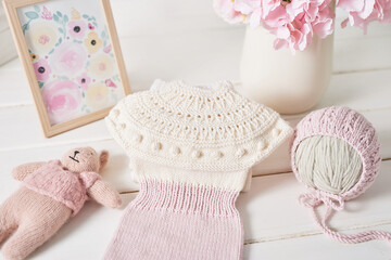 Knitted kids clothes and accessories for knitting. Needlework and knitting. Hobbies and creativity. Knit for children. Handmade