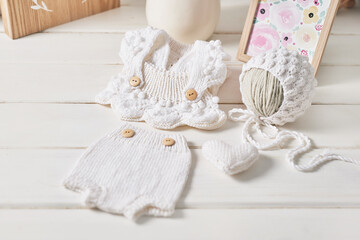 Knitted kids clothes and accessories for knitting. Needlework and knitting. Hobbies and creativity. Knit for children. Handmade