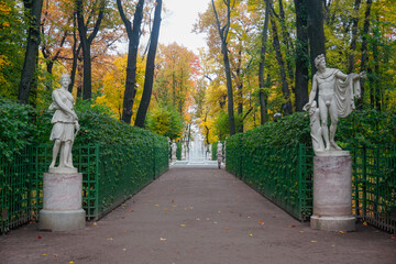 Beautiful autumn summer garden with fountains in St. Petersburg