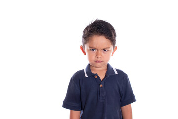 Beautiful angry boy looking at camera, isolated on white background. Very angry latin boy.