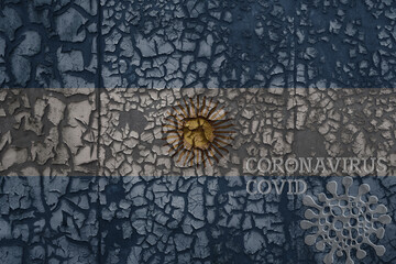 flag of argentina on a old metal rusty cracked wall with text coronavirus, covid, and virus picture.