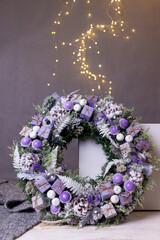 A traditional Christmas composition in lilac on a gray background