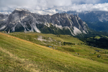 Fototapeta premium Hiking path and epic landscape of Seceda peak in Dolomites Alps, Odle mountain range, South Tyrol, Italy, Europe