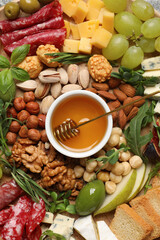 Different tasty appetizers as background, top view