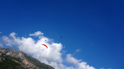   paragliding flight in the mountains      