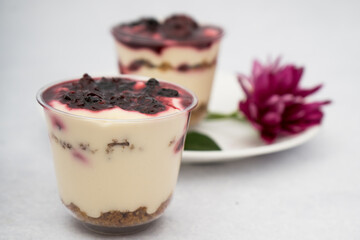 dessert with berries and flowers on a marble background