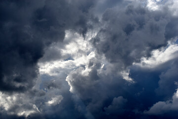 Naklejka na ściany i meble Blue and white cumulus storm clouds thunderstorm landscape