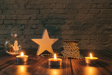 xmas lights ​in the dark, christmas candles on a yellow backgroun