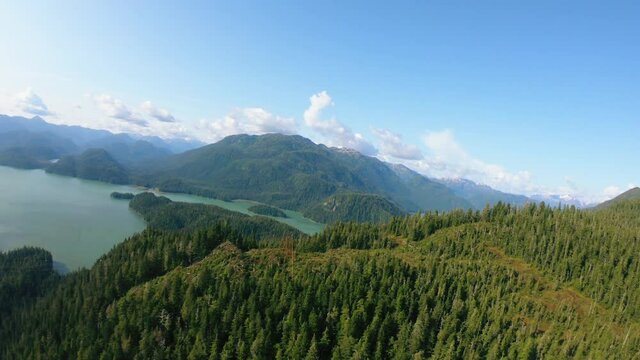 Aerial shooting from flying drone of an beautiful view of mountains and lake, Alaska.