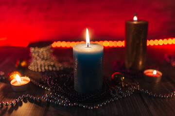candles in the dark, christmas candles on a red background