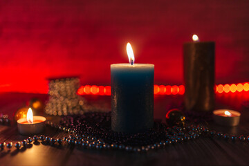 candles in the dark, christmas candles on a red background