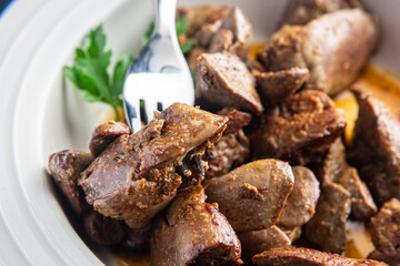 chicken liver fried or stewed fresh offal portion ready to eat meal snack on the table copy space food background rustic. top view keto or paleo diet