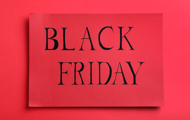 Obraz premium Card with words Black Friday on red background, top view