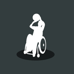 Silhouette of a boy in a wheelchair playing basketball. The concept of inclusion and diversity.