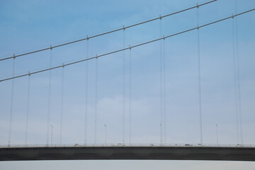 car cable-stayed bridge against a blue sky