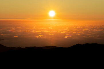 Sunrise in the mountains with plenty of clouds - Pico do Arieiro (Parque de Estacionamento, Madeira, Portugal).