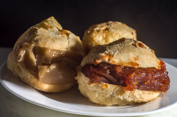 pães de queijo, cheese buns filled with dulce de leche, chocolate and guava jam 