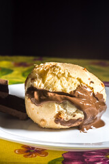 pão de queijo, cheese buns stuffed with chocolate in a white container,copy space and selective focus