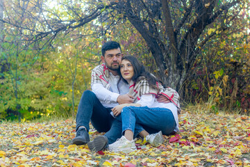the young romantic couple in autumn park, couple in the garden