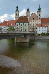 Fototapeta na wymiar Panorama of the romantic city of Steyr and Enns river on a cloudy day, Steyr, Austria