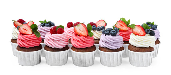 Sweet cupcakes with fresh berries on white background