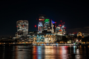 City of London one of the leading centres of global finance in night. Skyscrapers of over the Thames , England