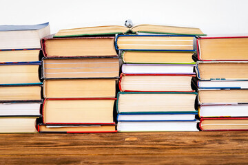 A stack of hardback books.